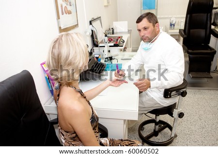 Doctor,examining a patient in ophthalmology laboratory