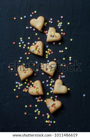 Valentine's Day cookie hearts cookies and decorations cookies on dark background, top view