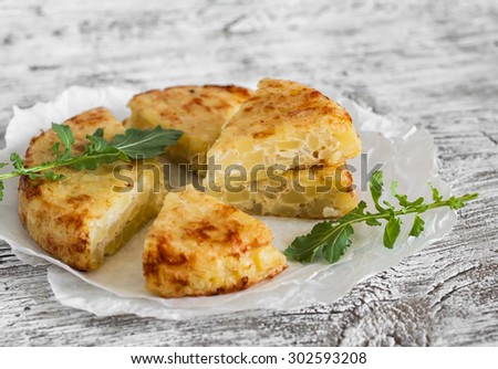 potato tortilla on a light wooden background