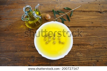 Olive oil in a table of kitchen.