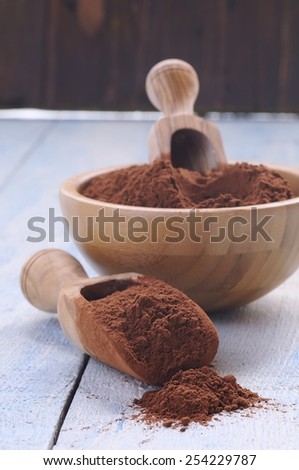 Cocoa powder on wooden table in the kitchen