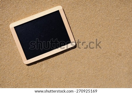 A lonely blackboard sand beach to leave a message