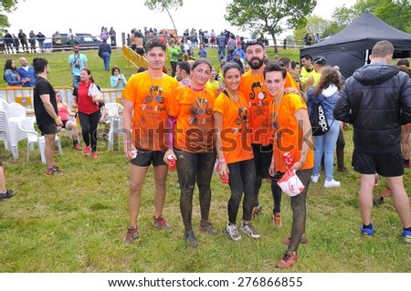 OVIEDO, SPAIN - MAY 9: Storm Race, an extreme obstacle course in May 9, 2015 in Oviedo, Spain. Runners with their medals celebrating finishing the extreme obstacle course.