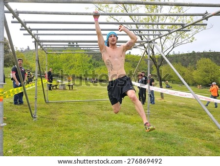 OVIEDO, SPAIN - MAY 9: Storm Race, an extreme obstacle course in May 9, 2015 in Oviedo, Spain. Runner going on an obstacle in the Storm Race of Oviedo.