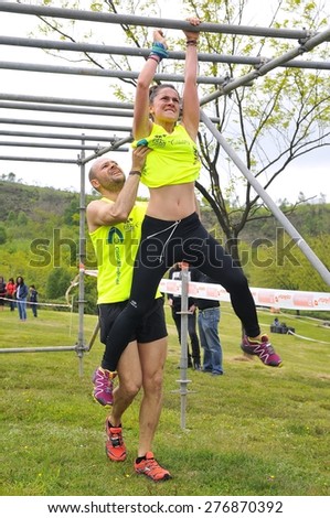 OVIEDO, SPAIN - MAY 9: Storm Race, an extreme obstacle course in May 9, 2015 in Oviedo, Spain. Runners going on an obstacle in the Storm Race of Oviedo.