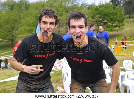 OVIEDO, SPAIN - MAY 9: Storm Race, an extreme obstacle course in May 9, 2015 in Oviedo, Spain. Runners with their medals celebrating finishing the extreme obstacle course.