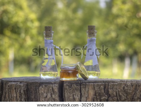 Traditional Serbian drink with 2 little bottles and honey and nuts
