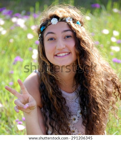 Girl with flowers in her hair, peace and love
