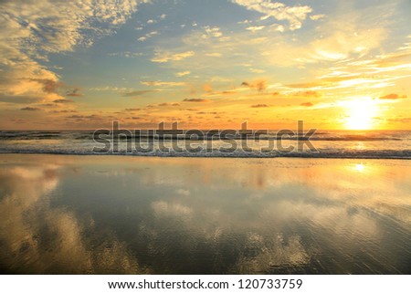 Sunrise at the Beach Centered to Take Advantage of the Perfect Reflection
