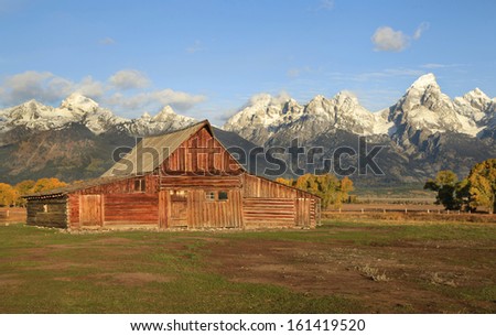 The moulton barn at sunrise in the fall , grand tetons national park