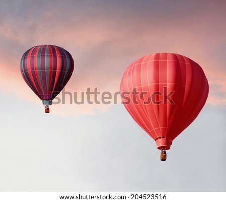 Hot Air Balloons Ascending in a Beautiful Sunset