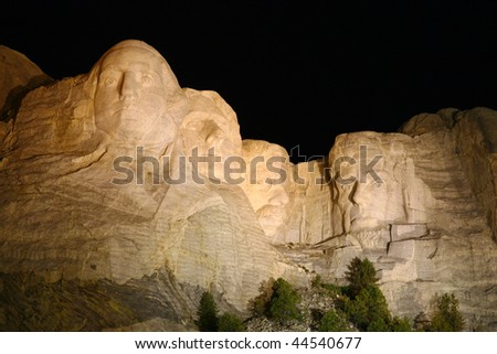 Mount Rushmore Monument Taken at Night While Illuminated with Flood Lights
