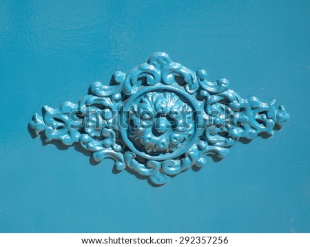 metal blue ornament on a door, in France