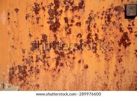Rusty Colored Metal with cracked paint, grunge background, ginger and red color