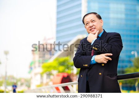 Asian senior businessman in suit portrait smiling