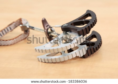Climbing camming devise. The piece of rock and alpine climbing equipment for arranging belay for the leading climber.