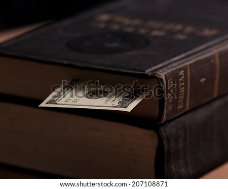 The volume of Capital by Karl Marx with hundred dollars note used as book marker