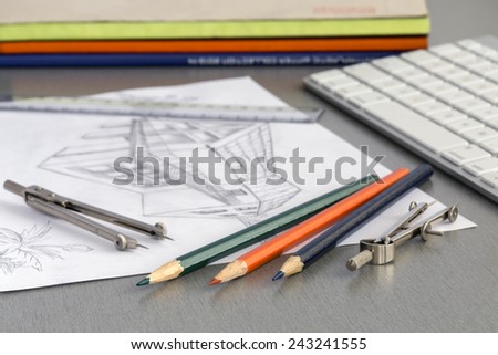 Working place of designer. Angle view of house plan drawing on the working place of architect, surrounded with designers working tools and modern computer keyboard