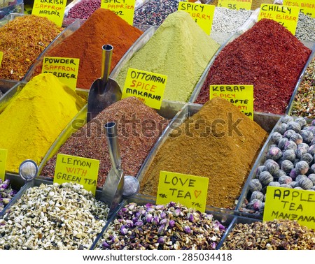 Eastern bazaar - selection of spices and tea. Image of selling point at Istanbul market with piles of colorful oriental spices and variety of tea
