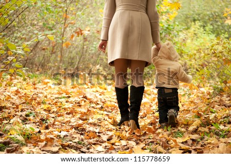 Mom and son walking in a park