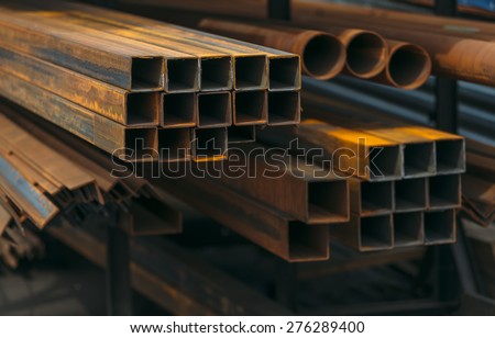open-air market of steel products in the city. a lot of different building material from iron . pipes and tubes .