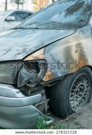 burned cars in the parking lot after the fire extinguishing wiring . during combustion fused plastic parts , wires and windshield.