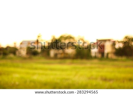 Out of focus house against sunset