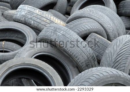 Old abandoned used tires waiting for recycling
