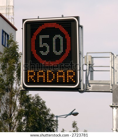 Police speed camera radar warning  on street in city
