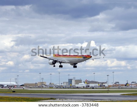 Modern passenger airplane landing in airport