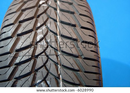 Brand new tire pattern on blue background