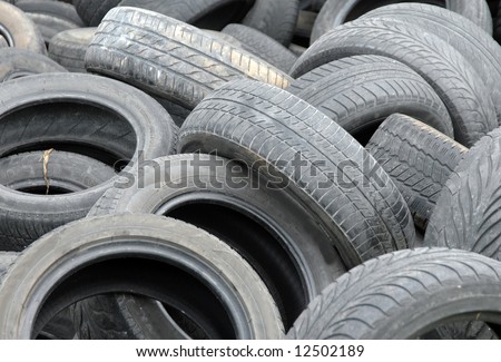 Old abandoned used tires waiting for recycling