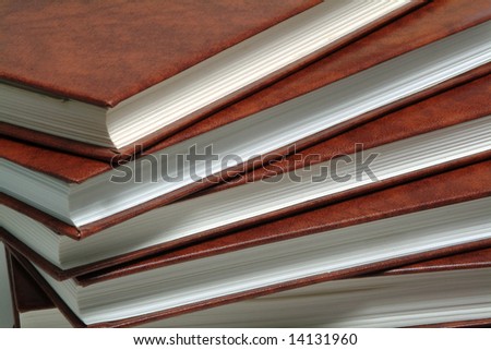 Stack of books with brown leather cover