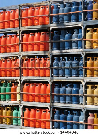 Stack of gas bottles in outdoor warehouse