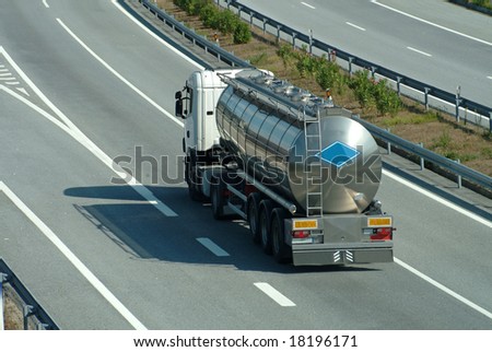 Large tanker truck rolling on highway