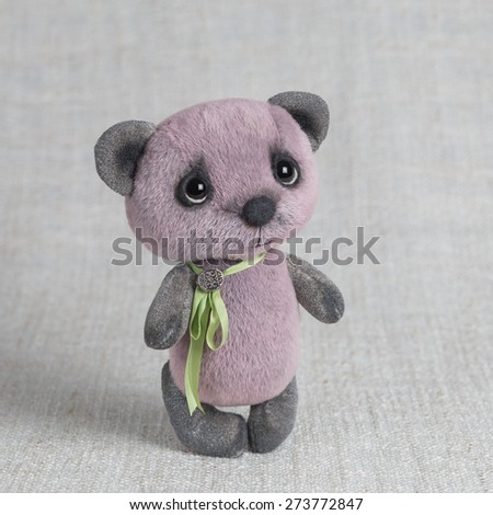 Violet artist Teddy bear with green ribbon