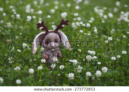 Artist Teddy bunny with flower