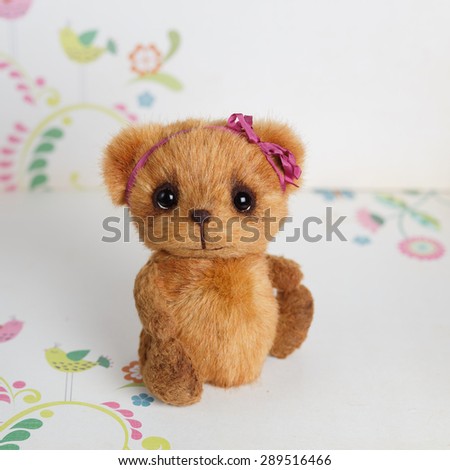 Brown artist teddy bear