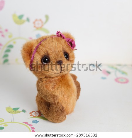 Brown artist teddy bear