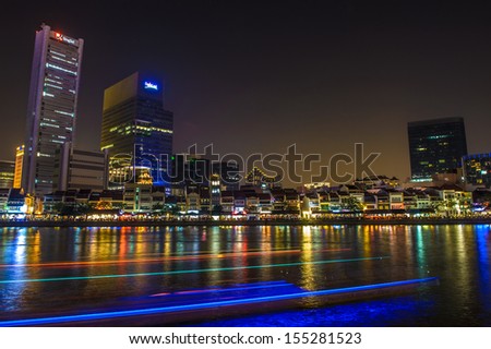 Singapore, Singapore - Sep 29 : Night shot of Singapore River by Boat Quay with rows of restaurant dining by the river on September 29, 2012.