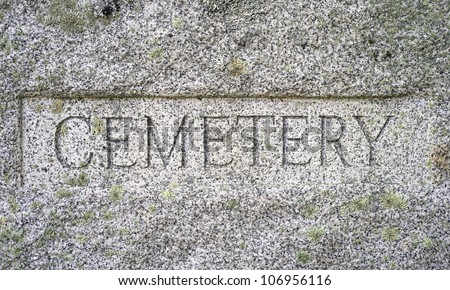 A very old granite block with Cemetery chiseled in bold lettering.