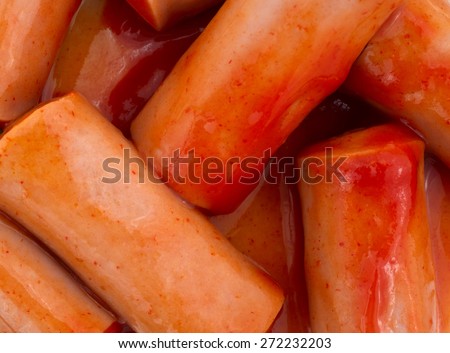 A very close view of small bite size hot and spicy sausages.