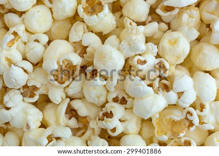 A close view of white cheddar cheese flavored popcorn.