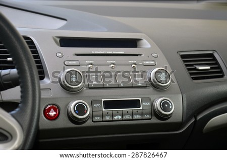 Car console with climatization control, car radio and music control