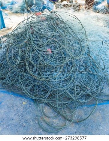 fisherman blue net catch crab and fish in sea