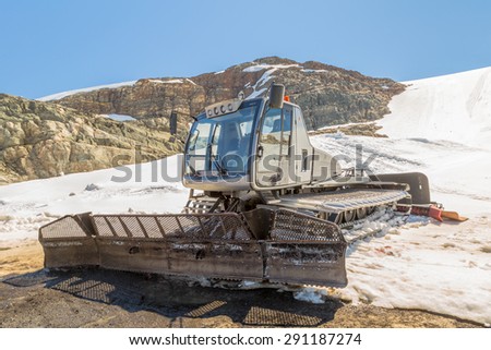 A snow-cat, machine for snow removal, preparation ski trails.