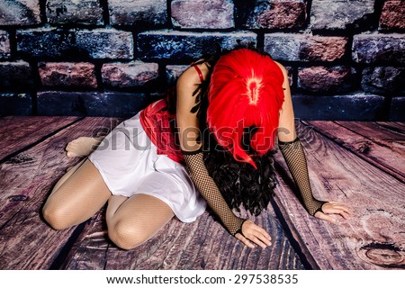Drug addict woman prostitute breaking down on the floor.