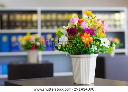 Artificial flowers vase in the library