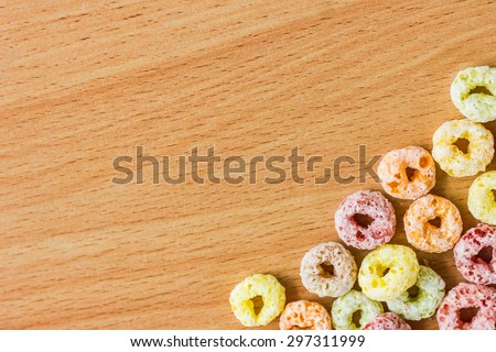 colorful Cereals in the right side of the wood texture