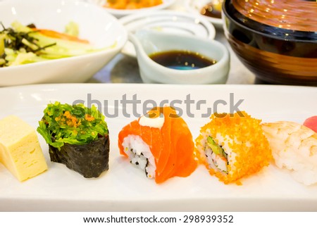 sushi -egg, salmon, seaweed and roe sushi